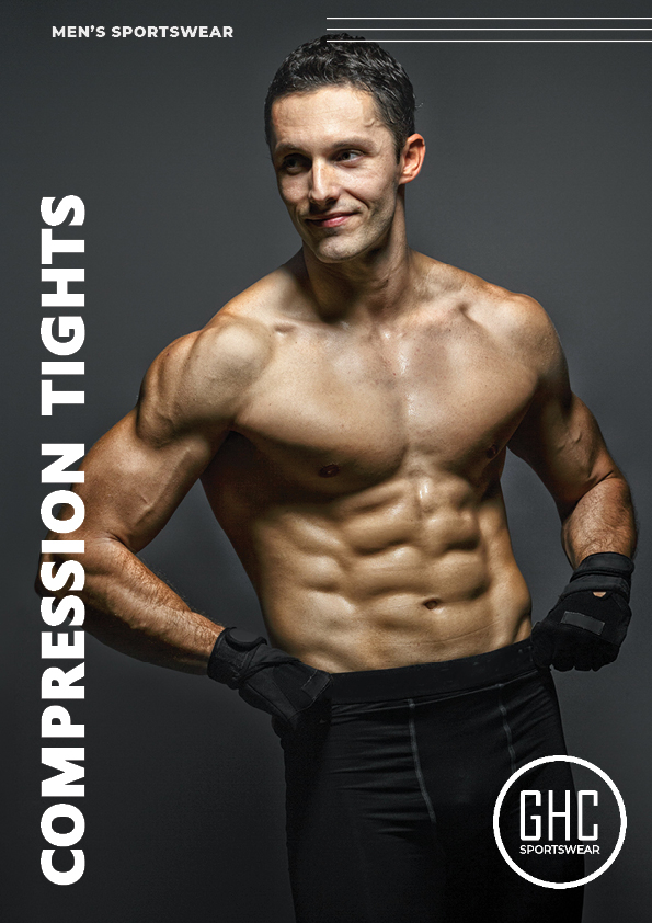 A muscular man wearing custom men's compression tights from GHC Sportswear, showcasing a sleek black design, standing confidently in a fitness studio.