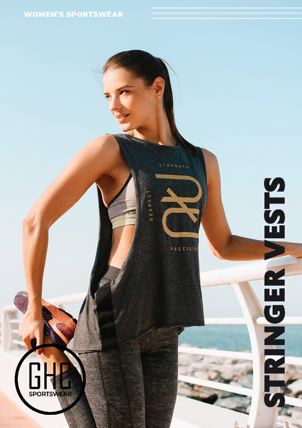 Woman stretching on a boardwalk wearing a custom women's stringer vest, with a serene ocean backdrop.