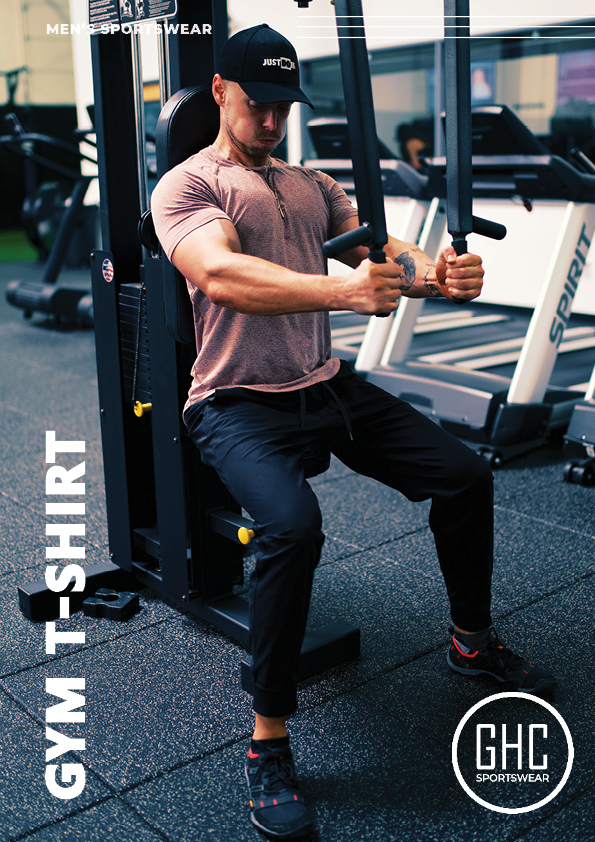 A man working out in the gym wearing a custom men's gym T-shirt by GHC Sportswear, featuring a tailored fit and performance fabric.