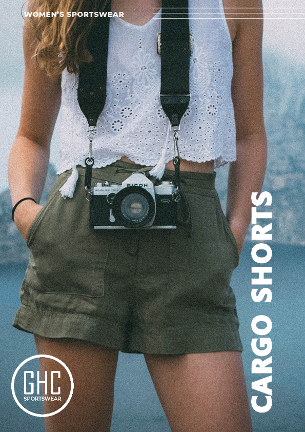 A woman wearing custom women's cargo shorts from GHC Sportswear, with a camera hanging from her neck, emphasizing the stylish and practical design of the shorts. The image highlights the customizability of the cargo shorts, perfect for any adventure or casual outing.