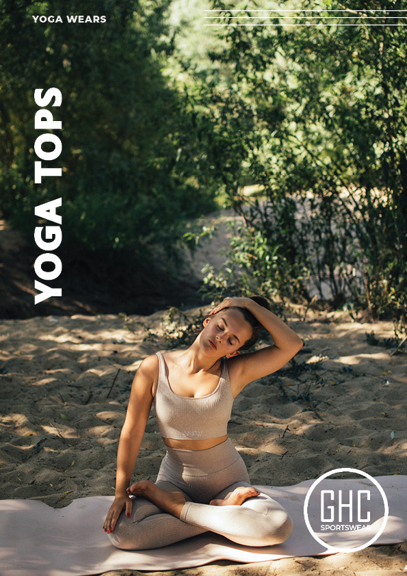 A promotional image for GHC Sportswear featuring a woman wearing a beige custom yoga top and matching leggings. She is seated on a yoga mat in an outdoor setting with trees and sunlight filtering through. She has one hand resting on her knee and the other hand touching her head. The text "YOGA TOPS" is written vertically on the left side, and the GHC Sportswear logo is at the bottom right.