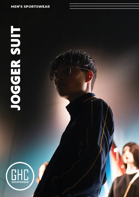 “A person wearing a dark jogger suit; custom OEM/ODM wholesale jogger suits produced by GHC Sportswear® for global B2B buyers.”