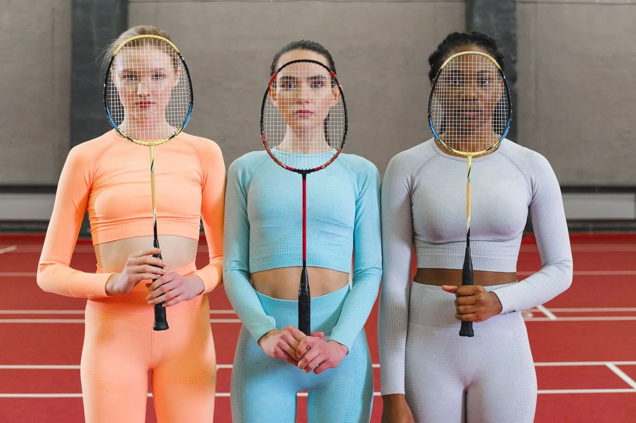 Badminton fashion line development with custom apparel sketches, fabric swatches, private label packaging, badminton uniforms, and sportswear manufacturing.