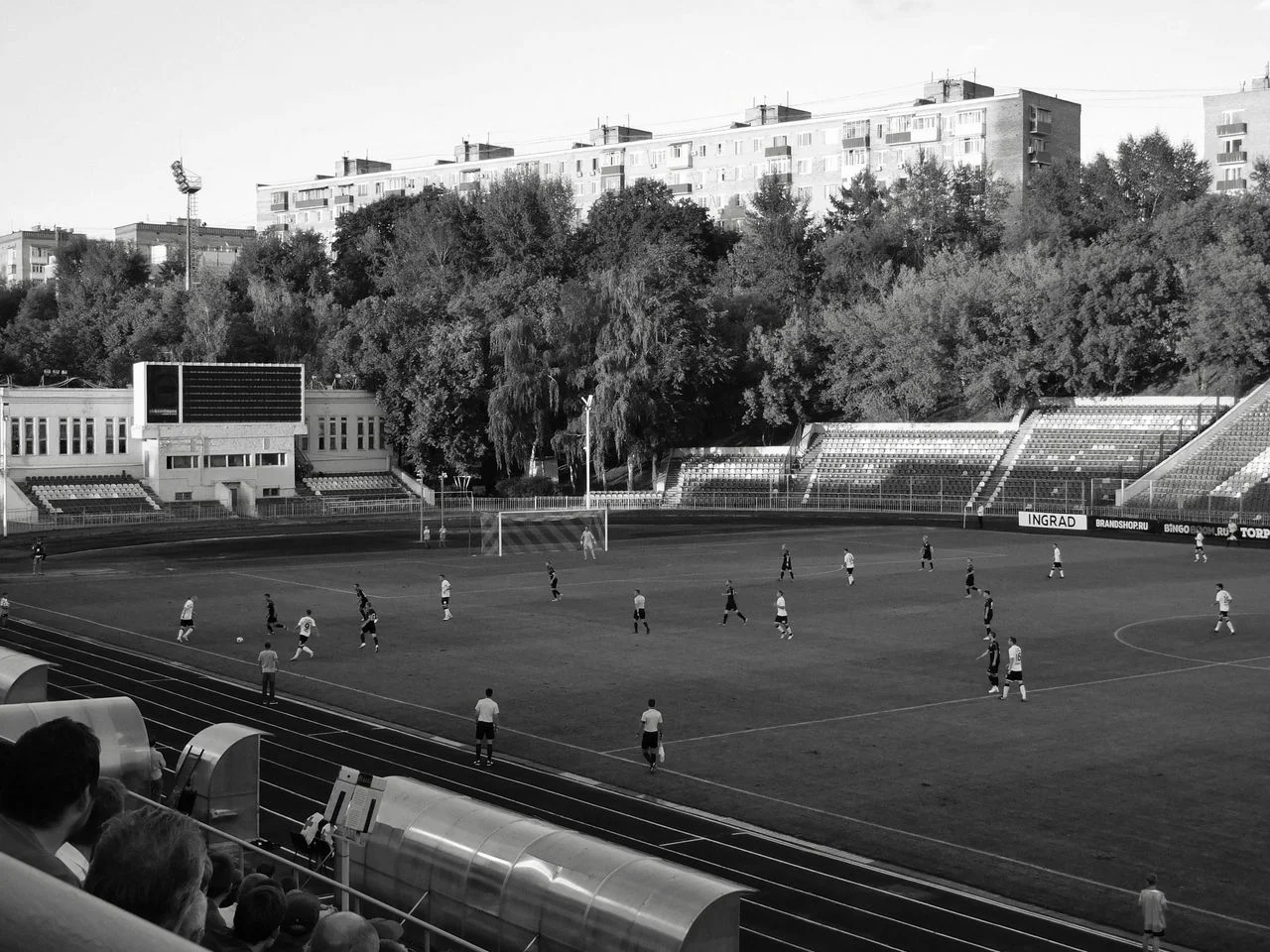History of football shown through vintage football gear, modern custom football uniforms, stadium culture, and team identity.