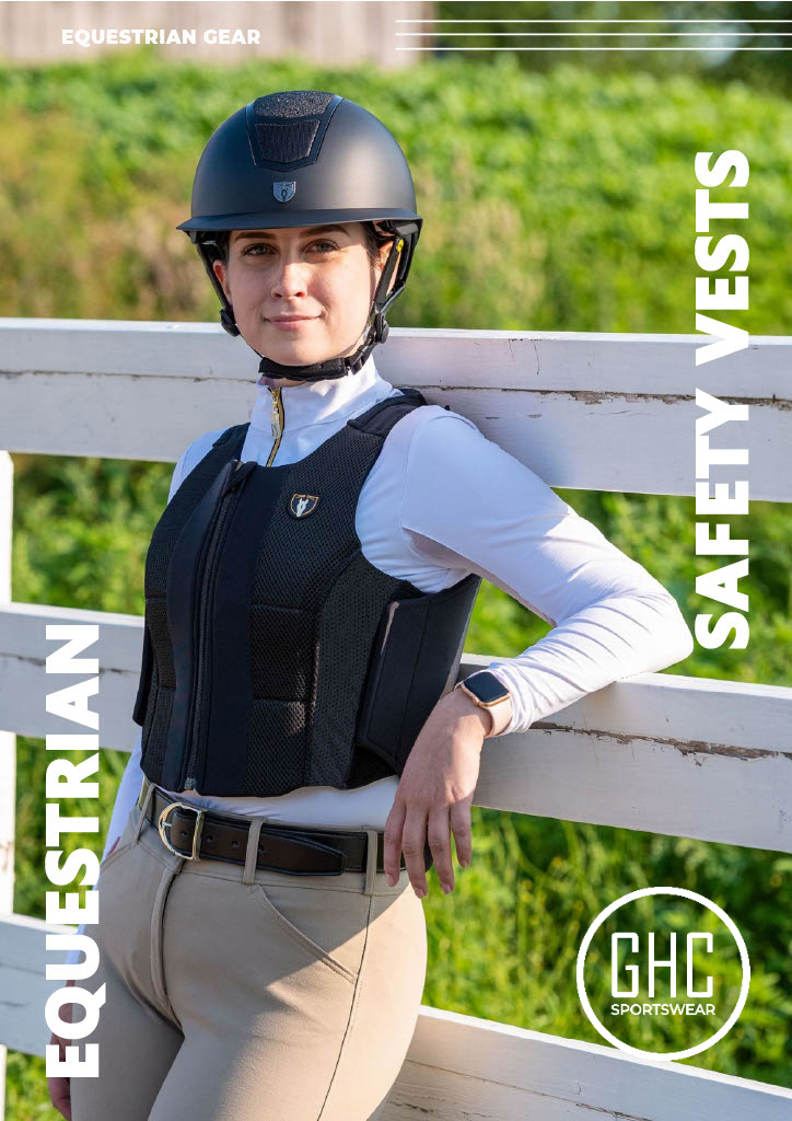 A rider wearing a custom black equestrian safety vest by GHC Sportswear® leans on a white fence outdoors. The vest features breathable mesh panels and ergonomic padding for comfort and protection. Text on the image reads “EQUESTRIAN GEAR / SAFETY VESTS.” This photo highlights OEM, private label, and wholesale equestrian safety vest manufacturing for global B2B buyers and distributors.