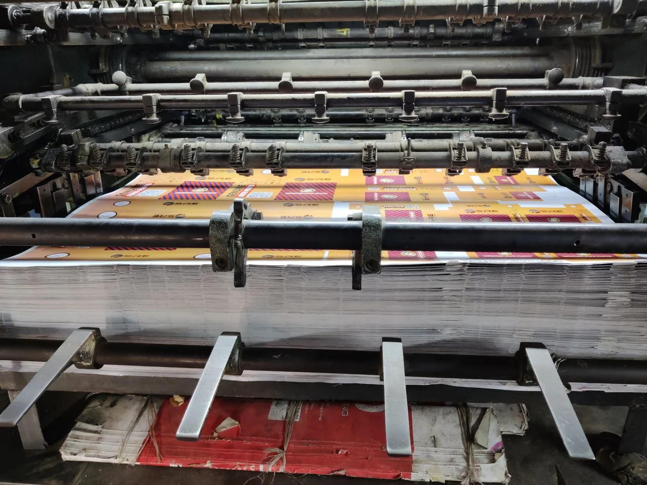 Pakistan custom sportswear manufacturer workspace with fabric swatches, tech packs, private label packaging, custom uniforms, and export-ready bulk production.