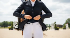 Professional rider selecting performance riding apparel before competition