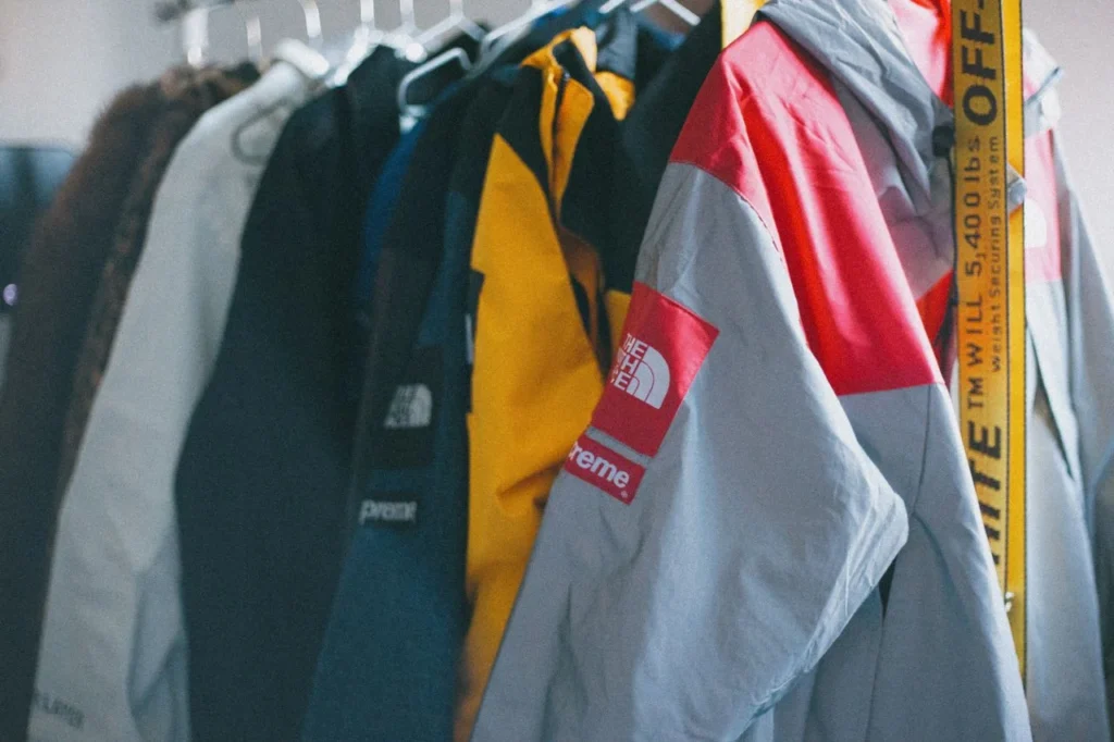 Apparel branding development with logos, colour standards, custom labels, embroidery, patches, packaging, SKU data and private label clothing production.