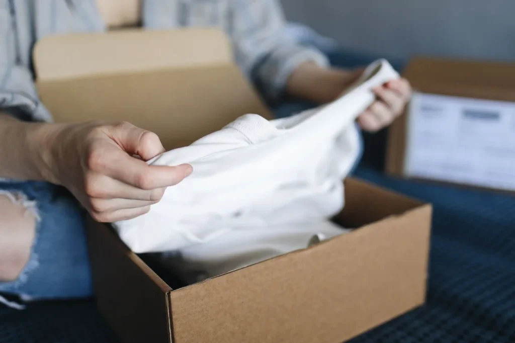 Apparel packaging development with branded garment bags, mailers, boxes, labels, barcodes, hang tags, export cartons and private label fulfilment.
